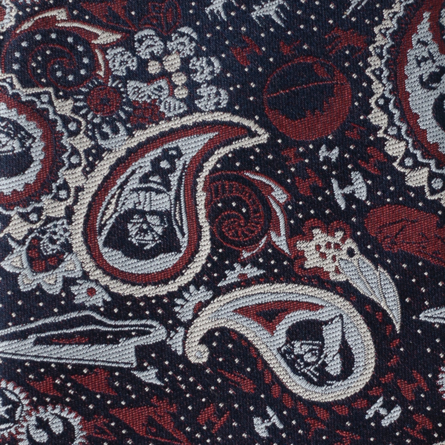 The Star Wars Darth Vader Navy Multicolored Paisley Tie by Cufflinks.com features a paisley pattern in red, white, and gray on navy—an officially licensed silk tie from Lucasfilm.