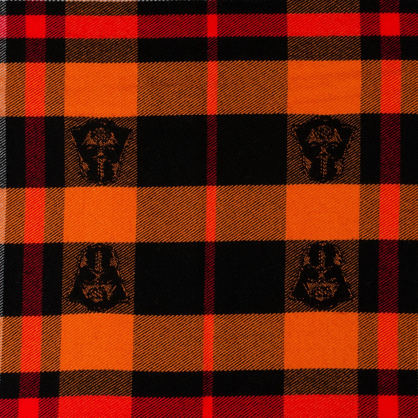 The Star Wars Darth Vader Black Tartan Scarf by Cufflinks.com features orange, black, red, and brown plaid, fringe edges, and Star Wars-inspired embroidered patches.