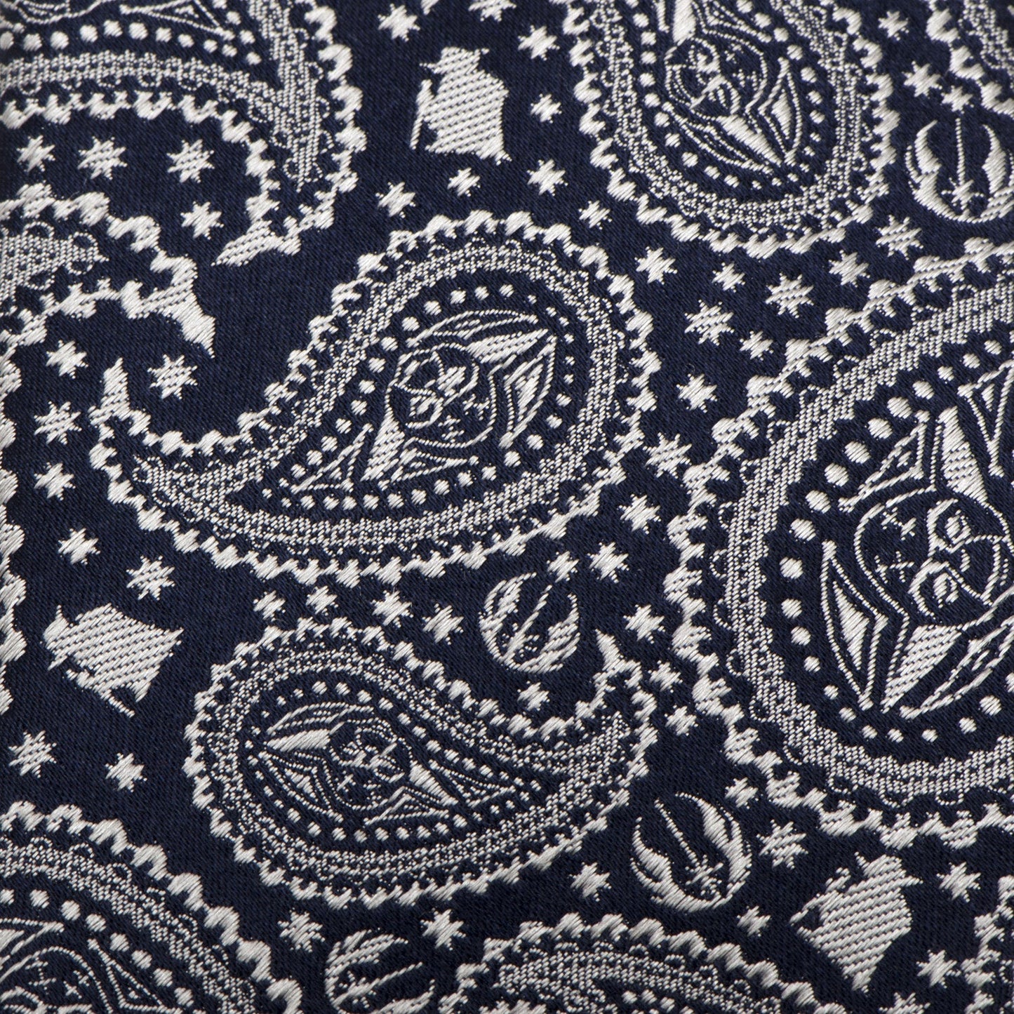 The Star Wars Yoda Navy Paisley Tie by Cufflinks.com features a navy silk background with a silver paisley and star design, subtly inspired by Star Wars style.