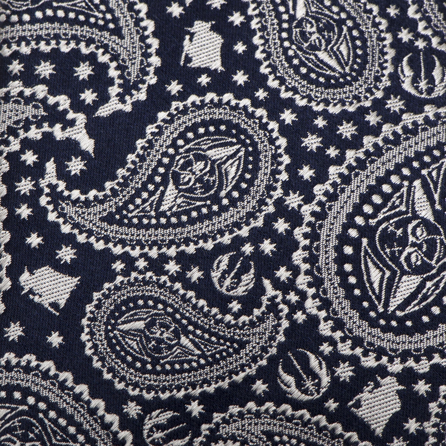 The Star Wars Yoda Navy Paisley Tie by Cufflinks.com features a navy silk background with a silver paisley and star design, subtly inspired by Star Wars style.