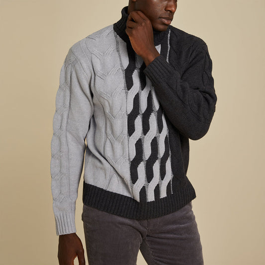A man wears an Inserch Cotton Blend Cable Knit Turtleneck Sweater (SW303-04 Lt. Grey) paired with brown corduroy pants.