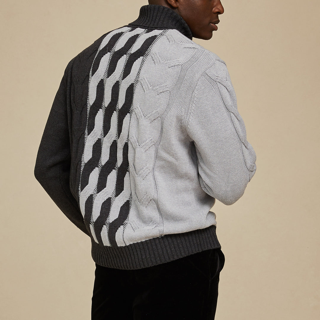 A man wears an Inserch Cotton Blend Cable Knit Turtleneck Sweater (SW303-04 Lt. Grey) paired with brown corduroy pants.