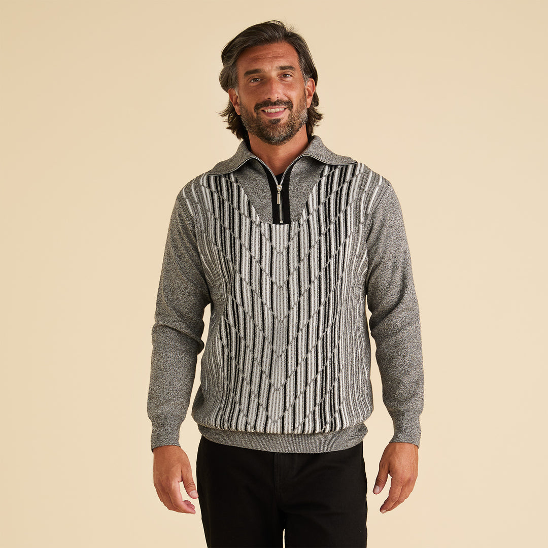 A man models the Inserch Geo Intarsia Half-Zip Sweater SW608-33 Grey, featuring a black and white geometric pattern, against a plain beige background.