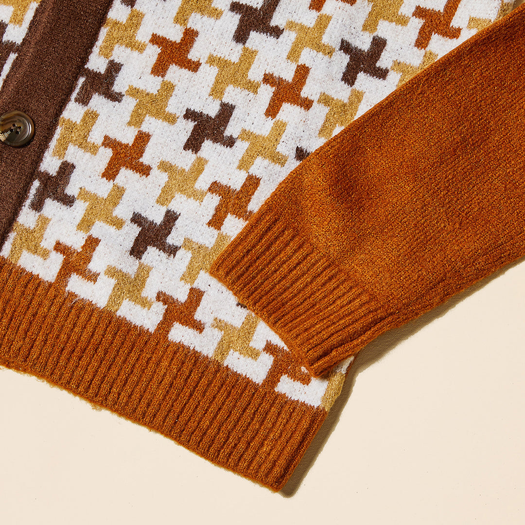 A man wears the Inserch Houndstooth Pattern Cardigan SW906-05 Caramel over a black turtleneck and tan pants, standing against a beige background.