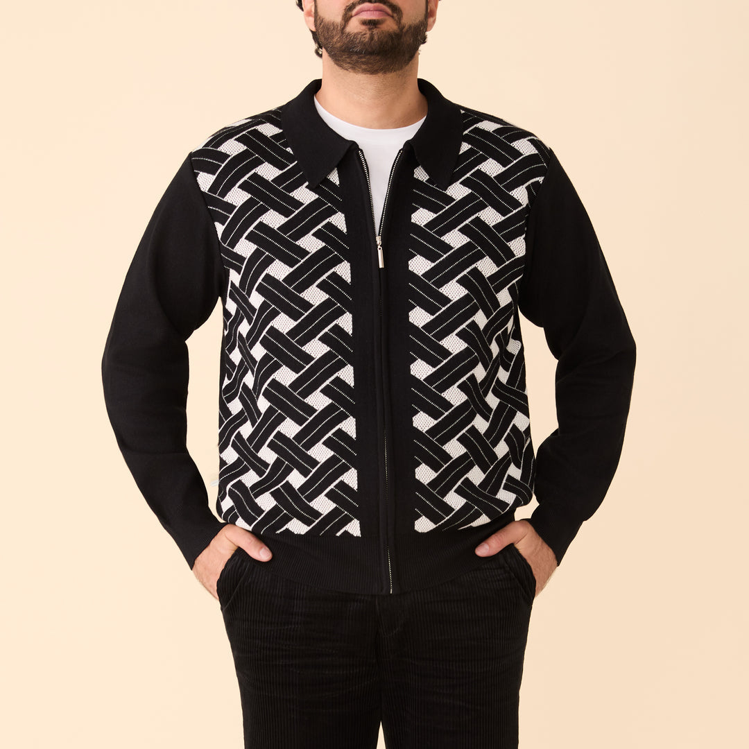 A man models the Inserch Geometric Full Zip Sweater SW908-00001 Black, featuring black sleeves, against a plain beige background.