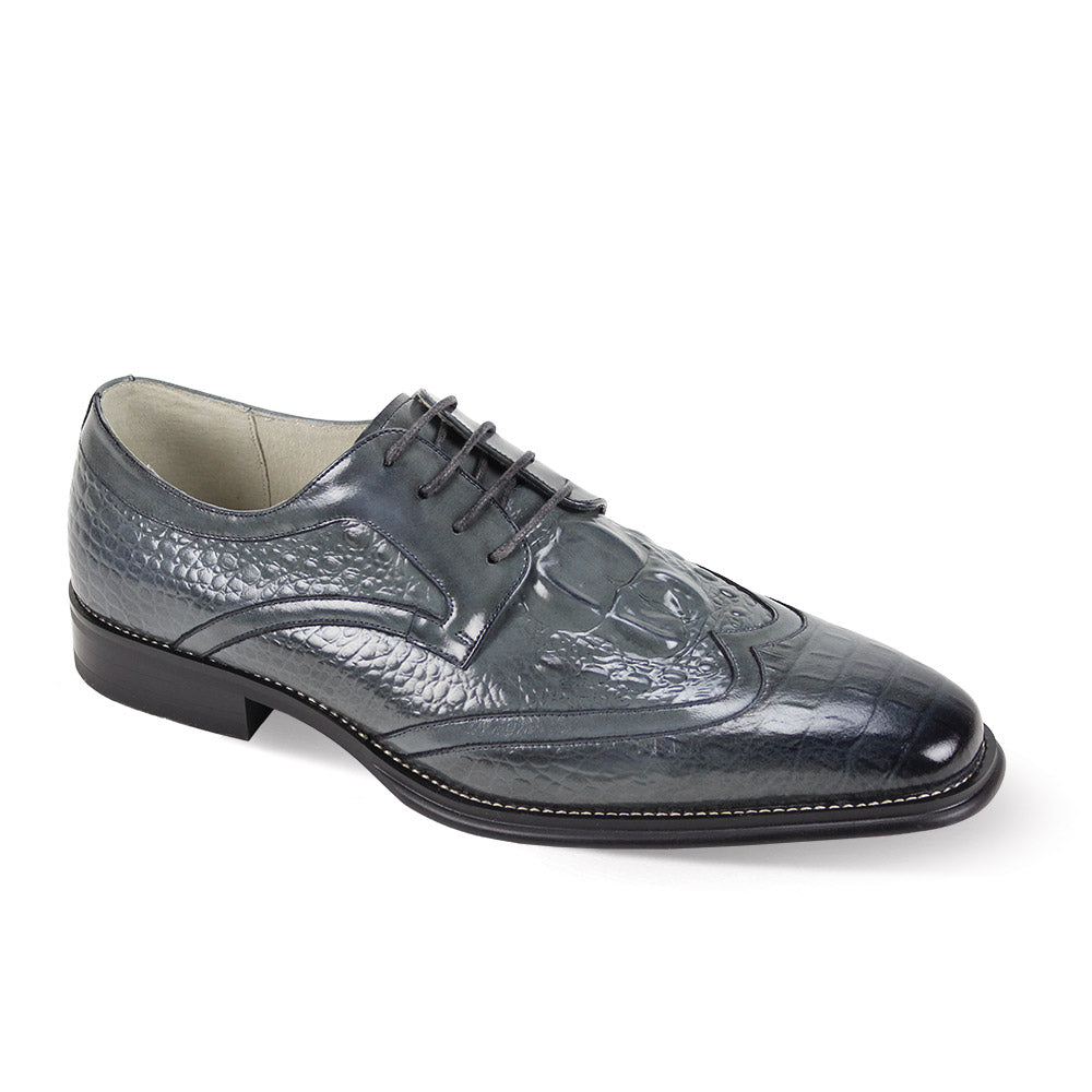 Introducing the Giovanni Shane Grey Leather Shoes by GIOVANNI, featuring a smooth dark gray finish with detailed wingtip lace patterns, a traditional lace-up closure, and a subtle low heel.