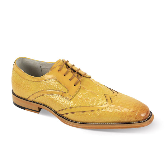 The Giovanni Shane Scotch Leather Shoes by GIOVANNI are yellow dress shoes with a crocodile pattern and elegant wingtip detailing, complemented by a low heel and brown lace-up closure.