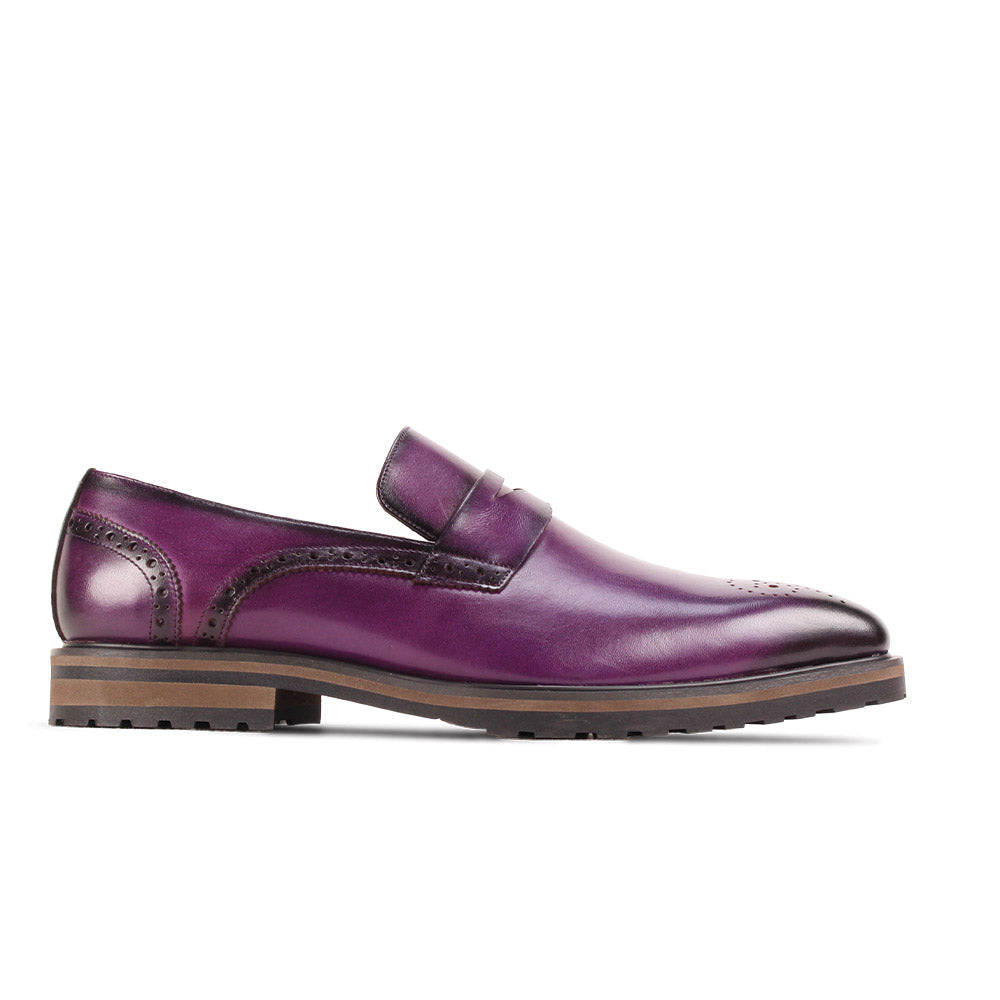 The GIOVANNI Silvio Purple Leather Shoes feature a single slip-on loafer design with a brown sole, decorative perforated toe, and visible stitching.