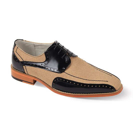 The Giovanni Simon shoes by GIOVANNI are black and tan leather wingtips with a classic lace-up design, wooden sole, and brogue medallion toe.