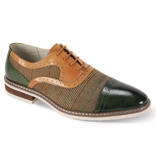 Introducing the Giovanni Sinclair Olive/Tan Leather Shoes by GIOVANNI, a stylish men's oxford featuring a blend of green and tan leather with brown accents, adorned with a patterned fabric panel. The shoe includes decorative perforations and a layered sole for added sophistication. It is completed with classic lace detail and an elegant cap toe design, offering a polished appearance.
