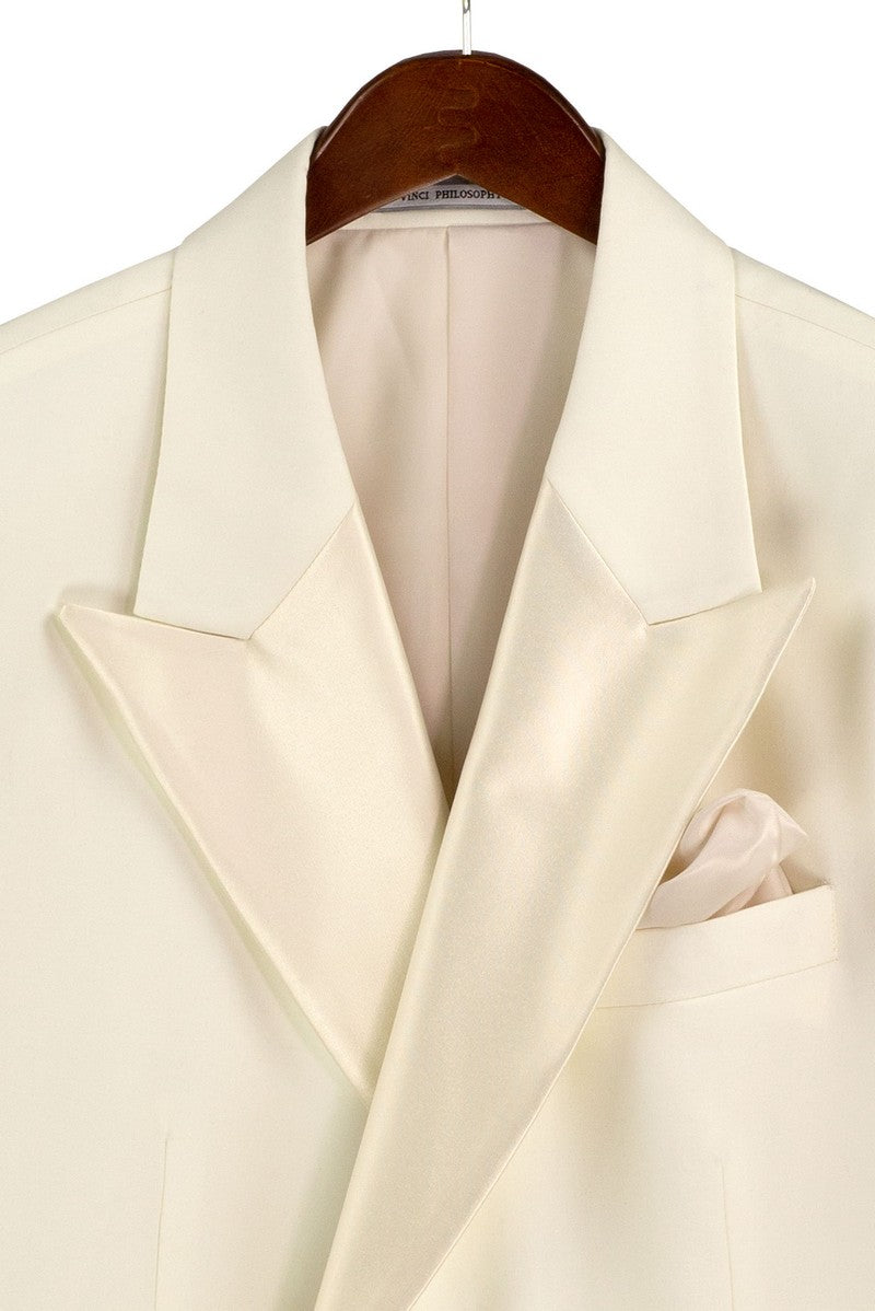 Mannequin dressed in Vinci Suits Regular Fit Ivory 2 Piece Double Breasted Satin Lapel Tuxedo TDB-900 with matching trousers, white shirt, cream bow tie, pocket square, and boutonniere.