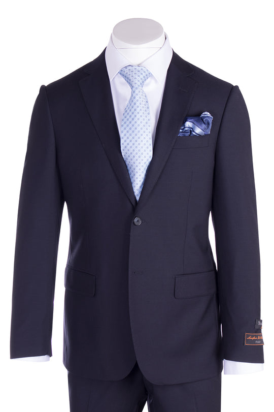 The Tiglio Luxe Novello Navy Blue Pure Wool Men’s Suit (TIG1002) by Tiglio Luxe is displayed on a mannequin with a light blue patterned tie, white dress shirt, and blue pocket square—an elegant choice in luxury men's clothing.