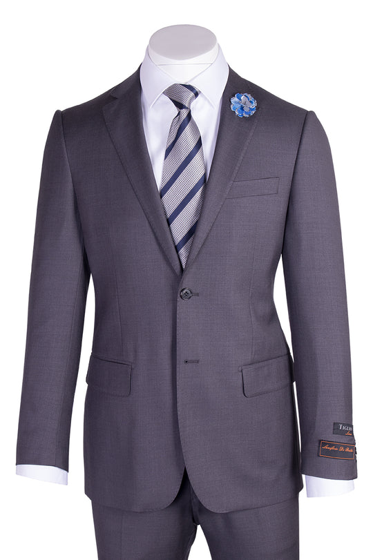 The Tiglio Luxe Novello Medium Gray Pure Wool Men’s Suit TIG1008 features a white dress shirt, striped tie, blue flower lapel pin, and a left sleeve label—Tiglio Luxe luxury fashion for men, displayed on a headless mannequin.