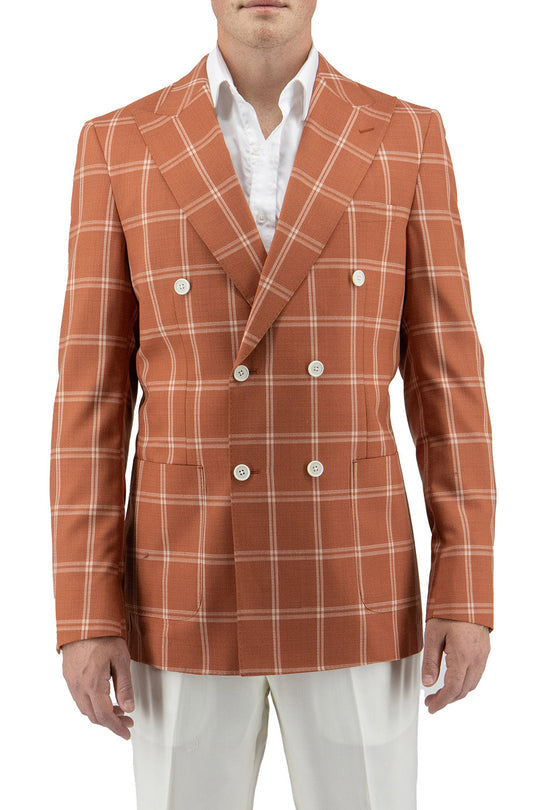 A person embracing sartorial traditions in a Tiglio Luxe Slim Fit Half Lined Pure Wool Jacket TL2632, featuring a burnt orange with off-white windowpane pattern over a crisp white dress shirt and trousers.