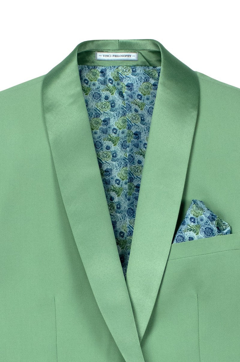 A mannequin dressed in the Slim Fit 2 Piece Stretch Fabric Suit Sage TSS-2 by Vinci Suits with matching bow tie, cream shirt, blue pocket square, and lapel pin.