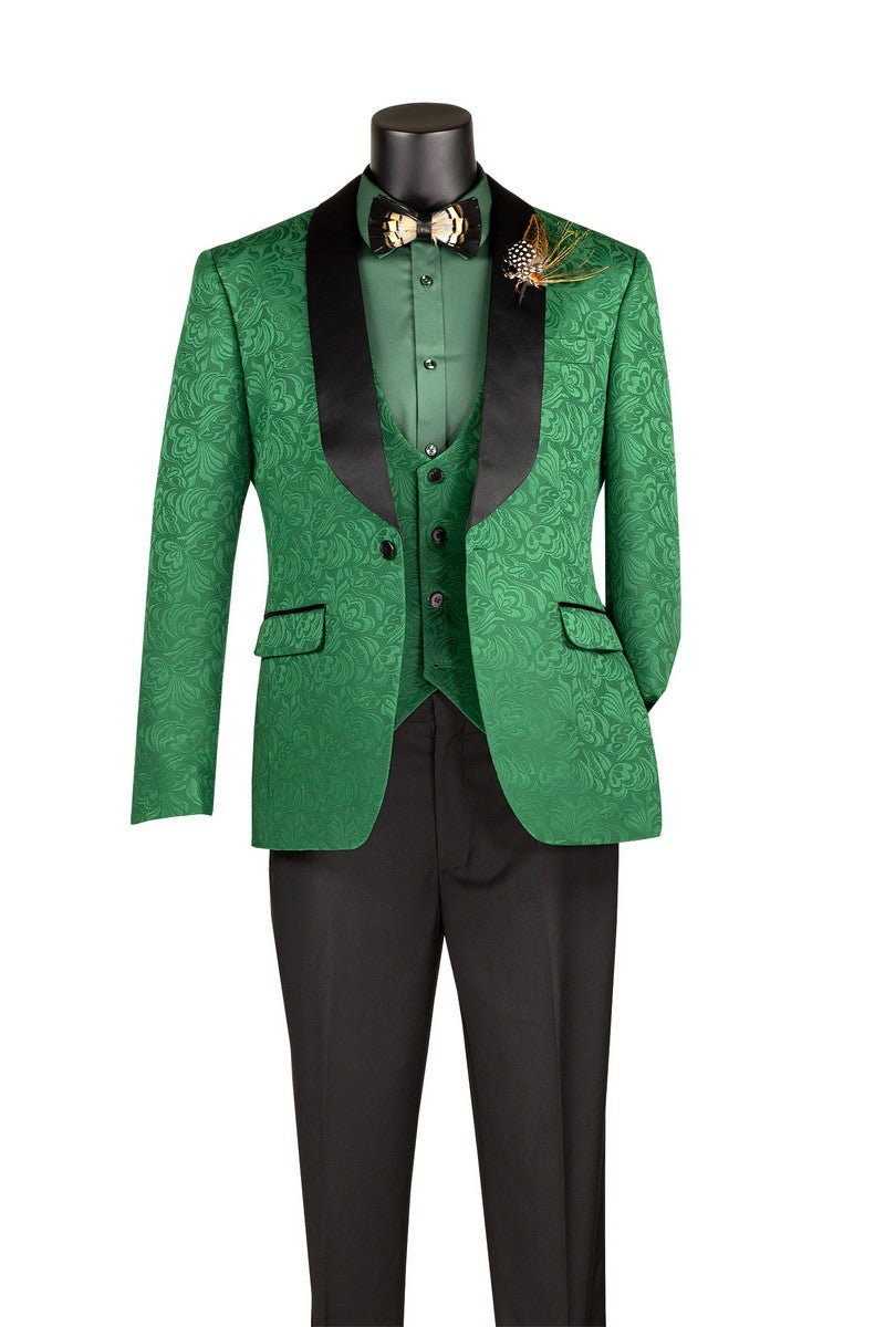 A mannequin showcases the Slim Fit Green Vested Jacquard Fabric 1 Button Fashion Tuxedo Style TVSJ-1 by Vinci Suits with matching vest, shirt, black pants, bow tie, and feather lapel pin.