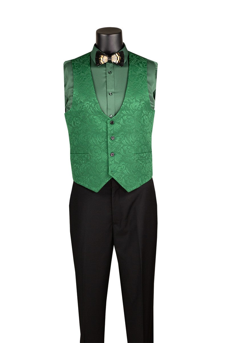 A mannequin showcases the Slim Fit Green Vested Jacquard Fabric 1 Button Fashion Tuxedo Style TVSJ-1 by Vinci Suits with matching vest, shirt, black pants, bow tie, and feather lapel pin.