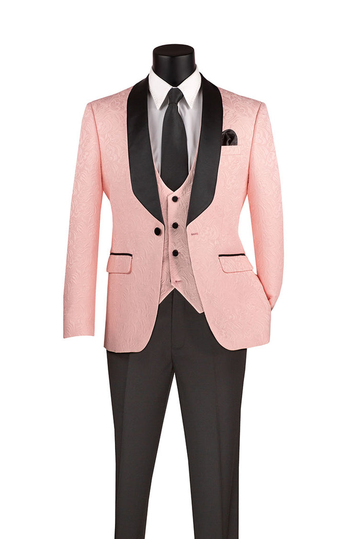 The Vinci Suits Slim Fit 3 Piece Single Button Jacquard Fabric Tuxedo Pink TVSJ-1 includes a pink tuxedo with a black satin lapel, white shirt, black tie, wrinkle-resistant black trousers, and is complemented by a matching pink vest and pocket square for a polished appearance.