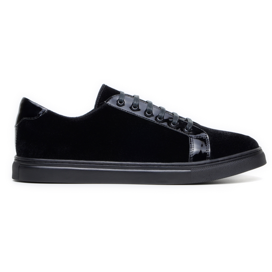 The BELVEDERE Belvedere - Teo is a black low-top sneaker featuring a velvet and patent leather finish, black laces, and a black rubber sole, shown in side profile on a white background.