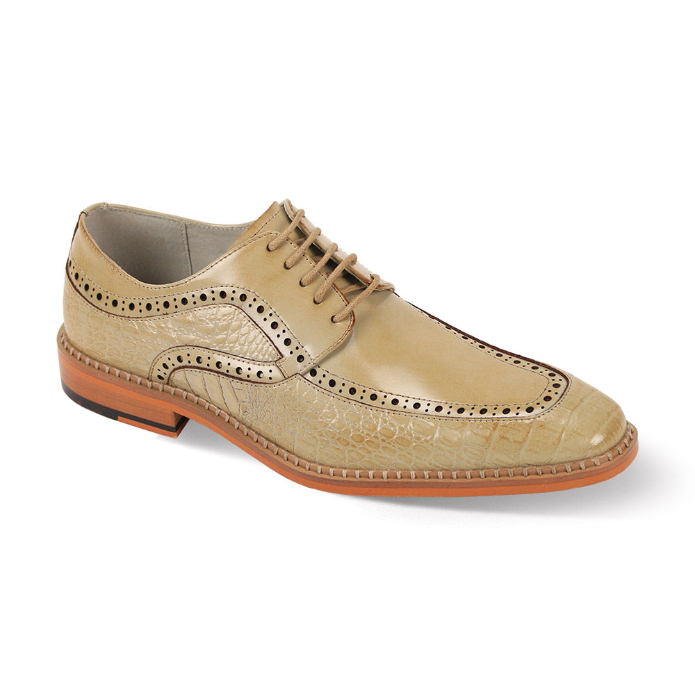 The Giovanni Terence Natural Leather Shoes by GIOVANNI are tan brogues with decorative perforations, detailed stitching, and a brown sole with croco print accents. Their lace-up design enhances their classic appeal.