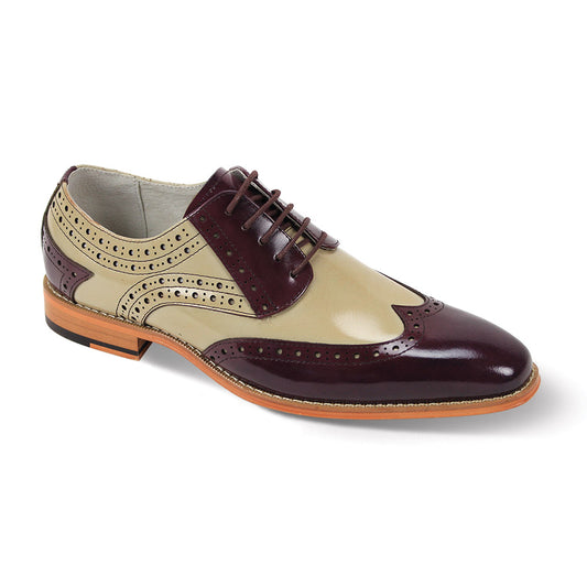 The Giovanni Troy Burgundy/Natural Leather Shoes by GIOVANNI feature a tan and burgundy wingtip brogue design with decorative perforations, elegant laces, and a refined wooden sole.