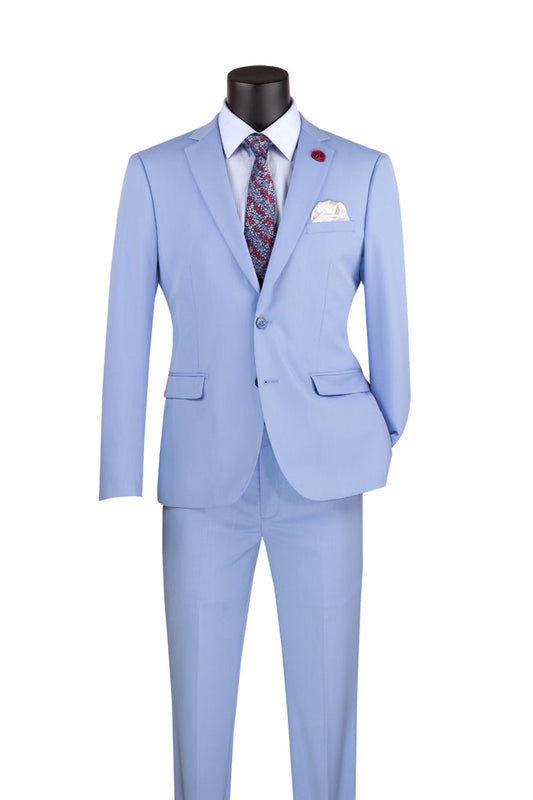 Vinci Suits' Ultra Slim Fit Stretch Wool Feel Suit in light blue, paired with a white shirt, patterned tie, and pocket square, is displayed on a mannequin.