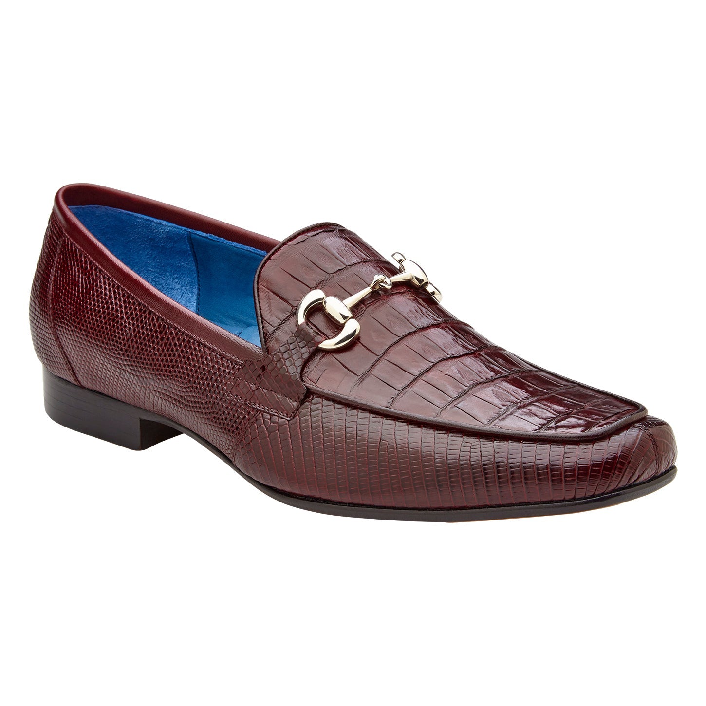 The BELVEDERE Udine 1030 is a burgundy loafer crafted from genuine caiman crocodile and lizard, featuring a textured pattern, leather sole, low black heel, and a metallic buckle detail.