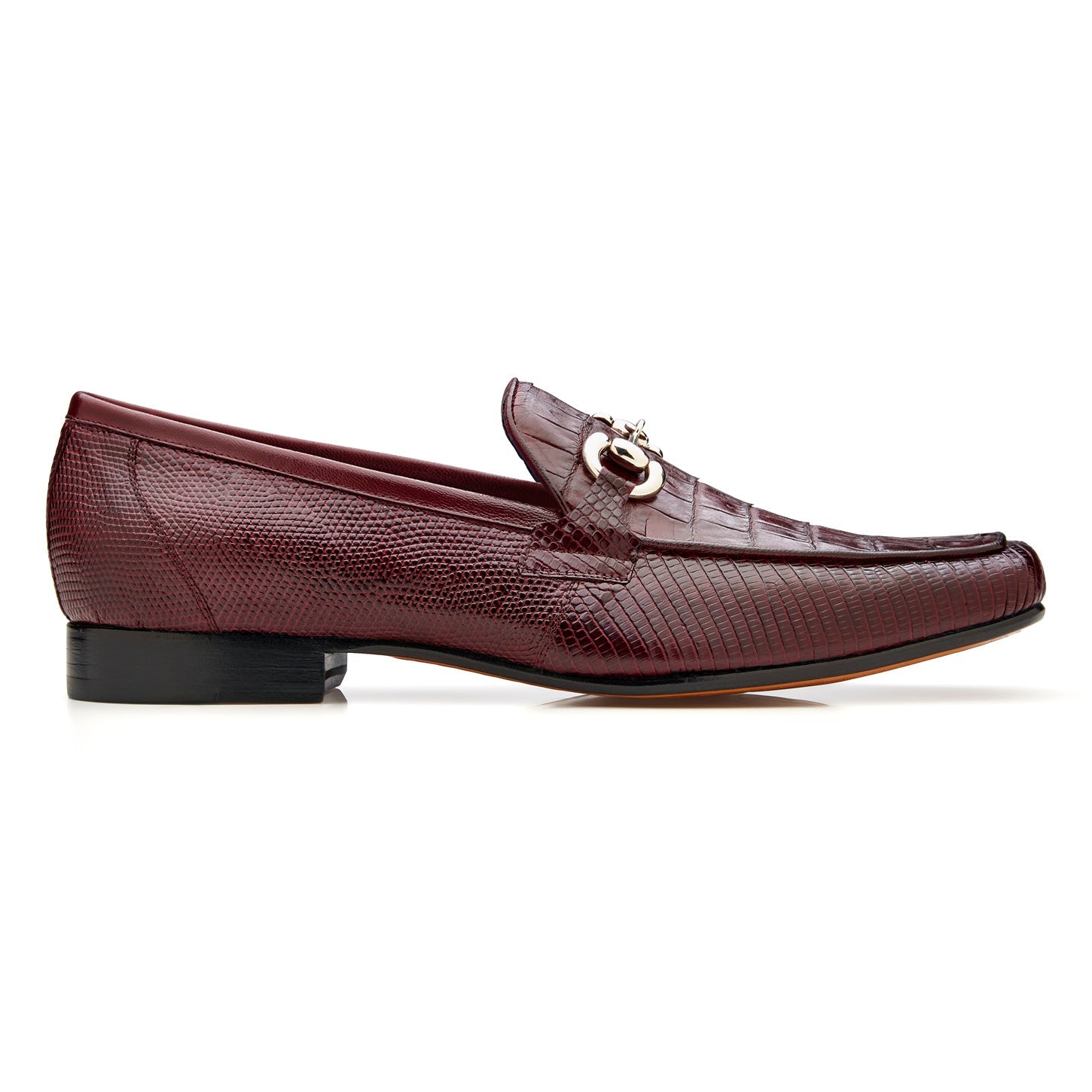 The BELVEDERE Udine 1030 is a burgundy loafer crafted from genuine caiman crocodile and lizard, featuring a textured pattern, leather sole, low black heel, and a metallic buckle detail.