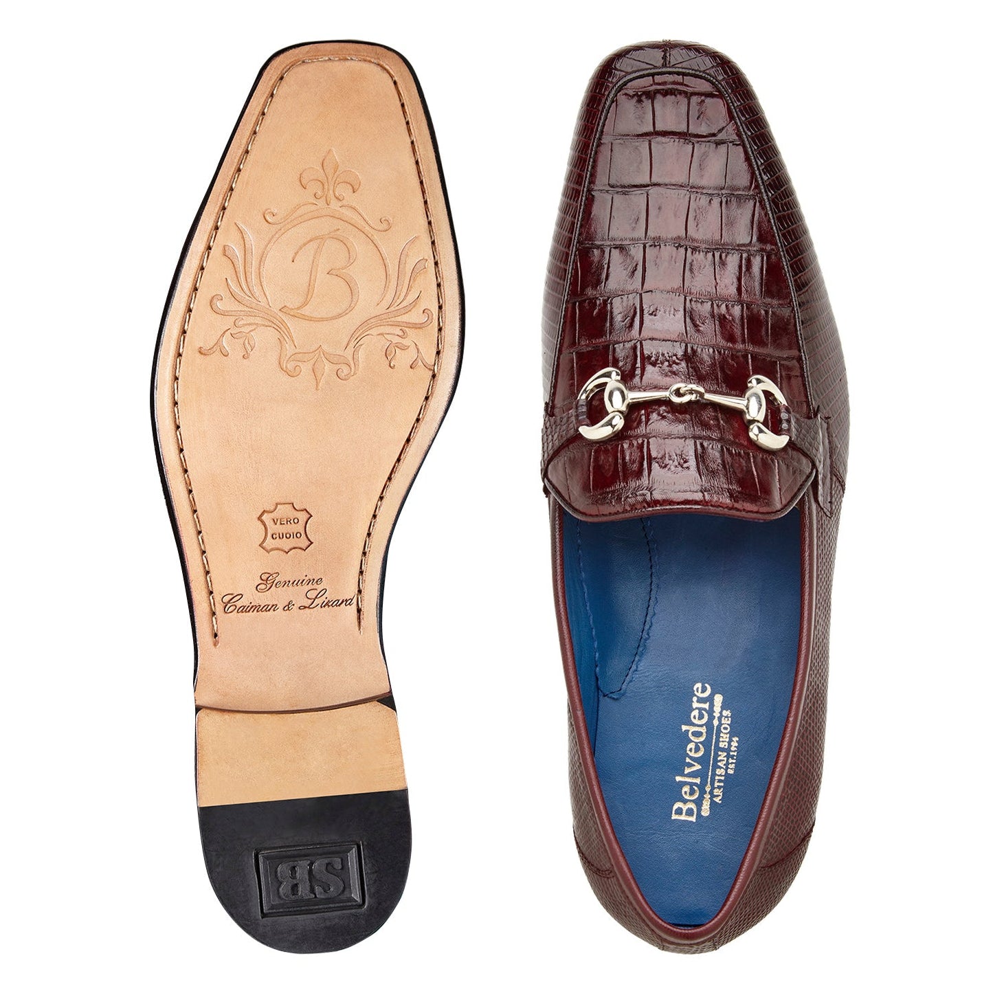 The BELVEDERE Udine 1030 is a burgundy loafer crafted from genuine caiman crocodile and lizard, featuring a textured pattern, leather sole, low black heel, and a metallic buckle detail.