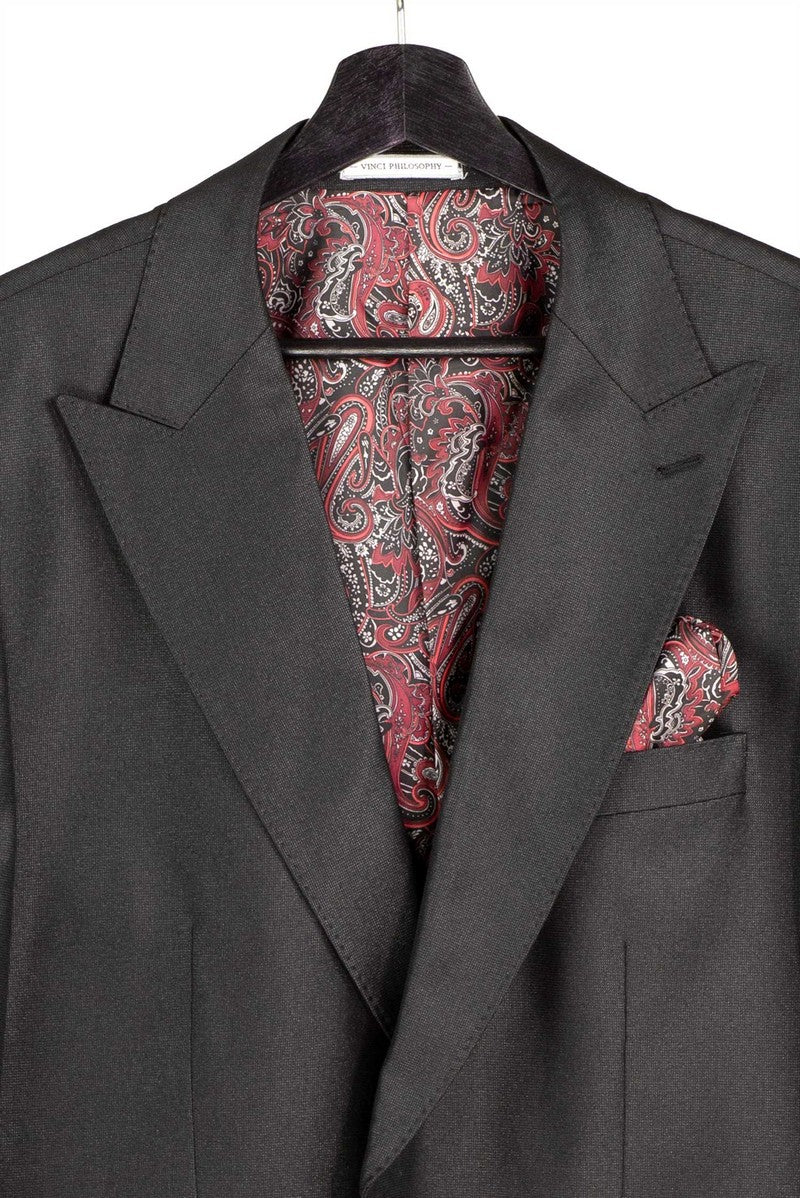 The Regular Fit Black 3 Piece Sharkskin Suit with Vest and Adjustable Waistband Pants V2RK-5 by Vinci Suits is styled with a pink shirt, patterned tie, pocket square, and gold chain on a mannequin.