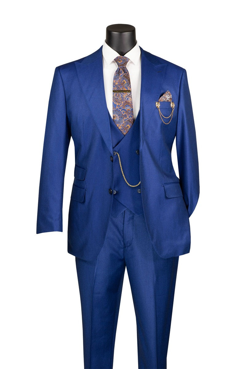 The Vinci Suits Regular Fit Estate Blue 3 Piece Sharkskin Suit with Vest and Adjustable Waistband Pants V2RK-5 is styled with a white shirt, paisley tie, gold chain, and pocket square.