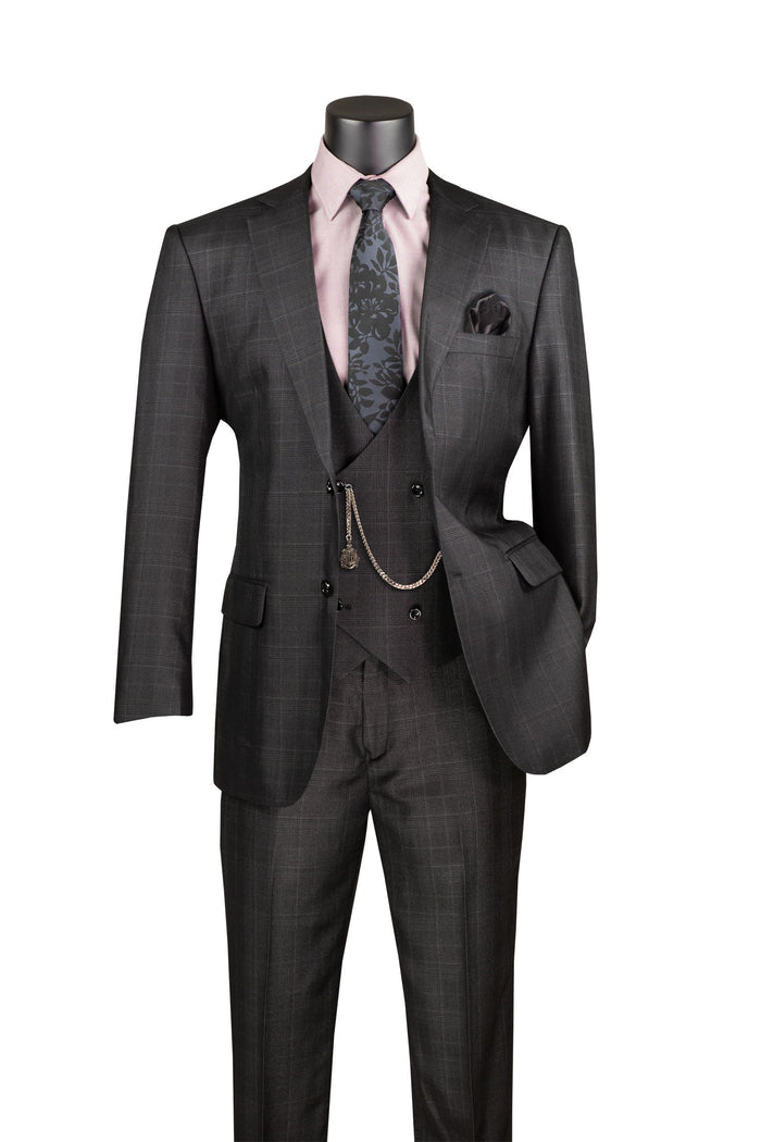 A mannequin showcases the Vinci Suits Regular Fit 3 Piece Suit (Black) V2RW-7, featuring a dark checkered design with a wrinkle-resistant, double-breasted vest. The ensemble is completed with a pink shirt, patterned tie, and pocket square for an impeccable finish.