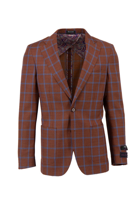 The Tiglio Luxe TL4224 jacket is a burn orange pure wool blazer with a blue windowpane pattern, featuring a single button closure, two front pockets, and a patterned half lining.