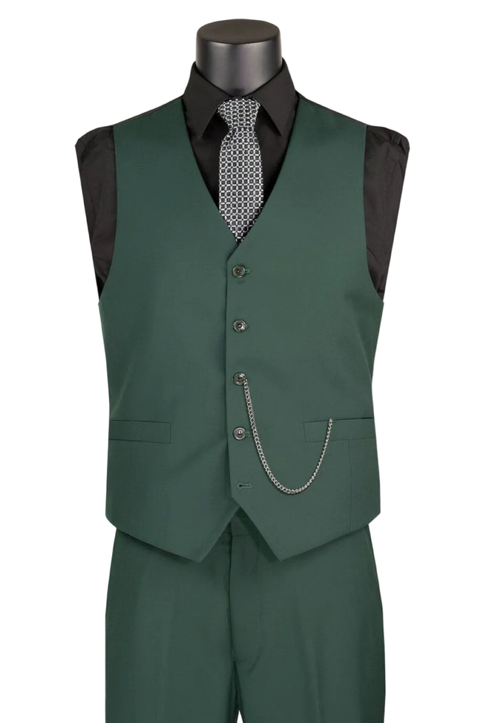 A mannequin showcases the Single Breasted 5 Button Vest Hunter Green OV-900 by Vinci Suits with matching pants, a black shirt, geometric tie, and vest chain accessory.
