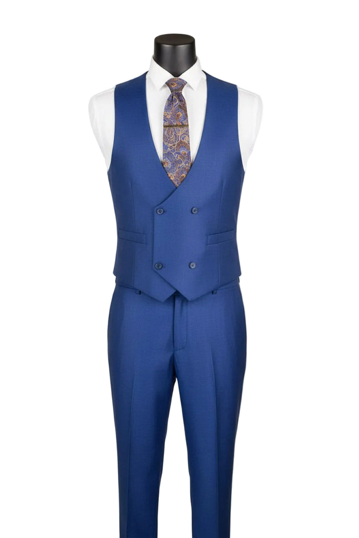 The Vinci Suits Regular Fit Estate Blue 3 Piece Sharkskin Suit with Vest and Adjustable Waistband Pants V2RK-5 is styled with a white shirt, paisley tie, gold chain, and pocket square.