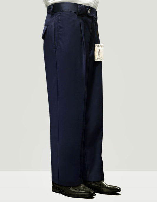 A person dressed in Statement Clothing's solid color wide-leg pants, model WP-100-NAVY, made from luxurious Italian wool fabric in navy blue, paired with black shoes and a price tag still attached.