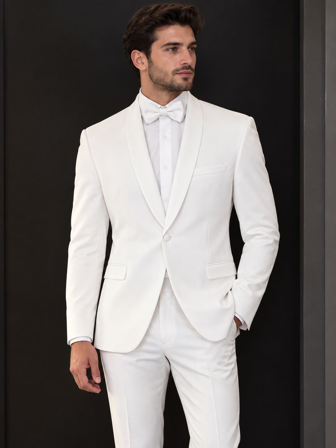 A man wears a white BOLZANO Shawl Collar Blazer with a matching dress shirt and white bow tie, offered as a final sale with no exchange or return.