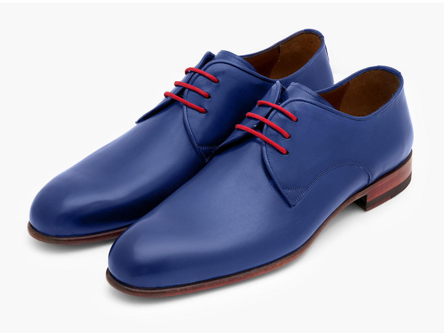 A pair of Paul Parkman Blue Hand Painted Derby Shoes (633BLU13) with red laces, brown inner lining, and brown soles are positioned side by side on a white background.