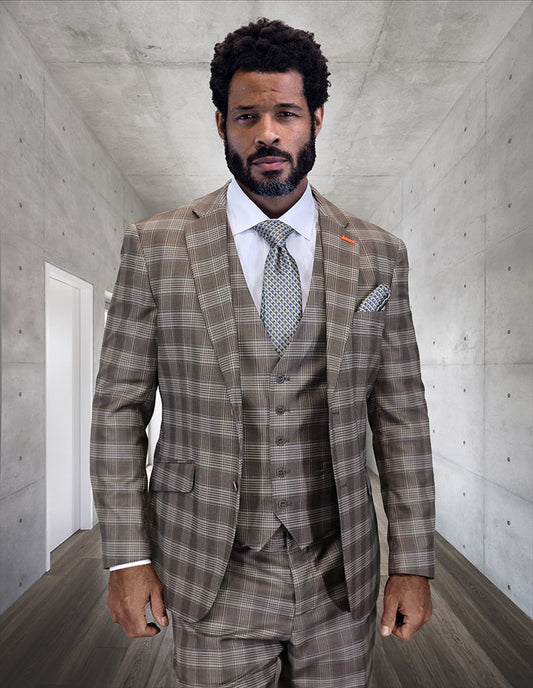 A bearded man wearing the Statement Clothing STATEMENT CLOTHING | ZILO-1-COCO modern fit charcoal Italian wool suit and tie stands in a sleek, concrete hallway.