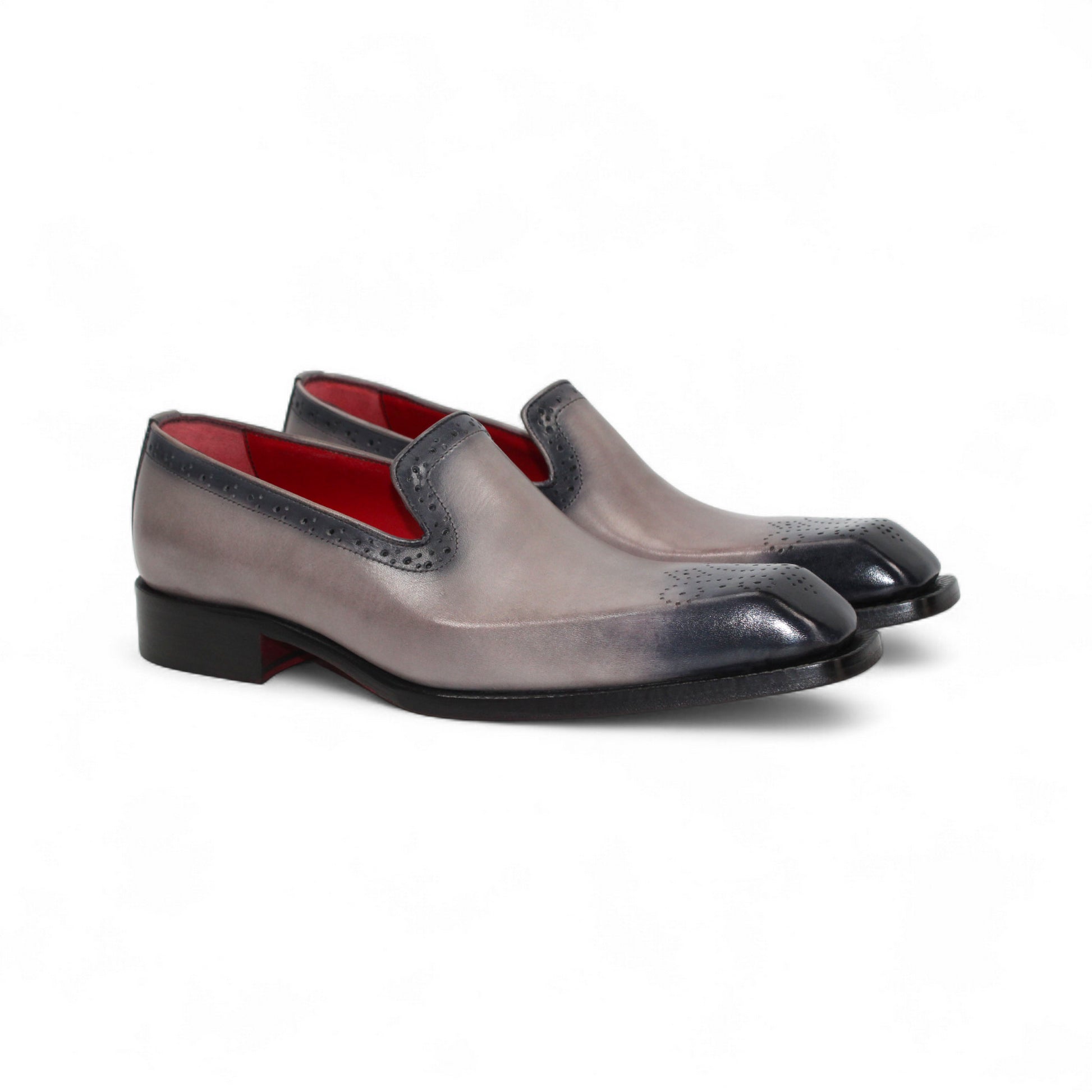 The Emilio Franco A014 Gray men's loafer features genuine grey leather, black toe and heel caps, subtle brogue details, red lining, and a low black heel—capturing minimalist style in a striking side profile.