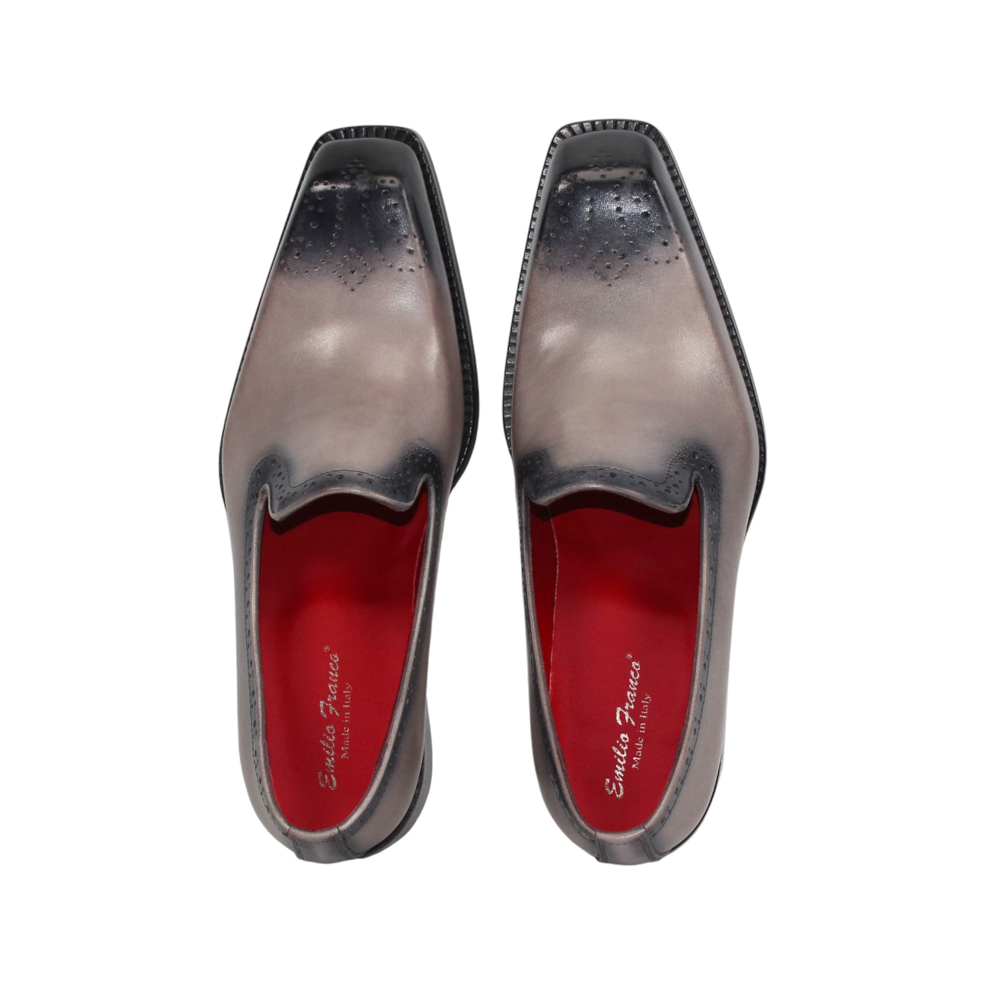 The Emilio Franco A014 Gray men's loafer features genuine grey leather, black toe and heel caps, subtle brogue details, red lining, and a low black heel—capturing minimalist style in a striking side profile.
