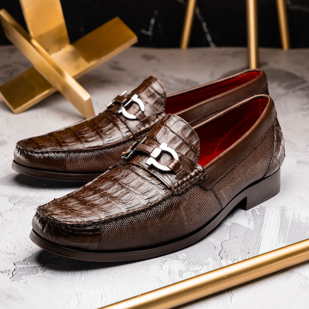 Introducing the Adro Brown by Marco Di Milano—crafted in brown leather with crocodile texture, silver buckle, red interior lining, and signature sole logo. A luxurious choice for those who value genuine exotic design.