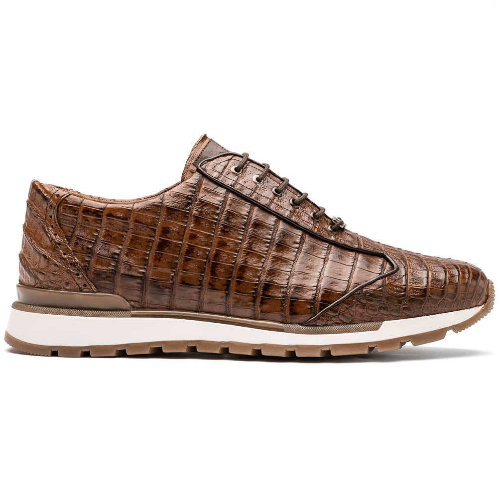 The Marco Di Milano Alonzo Bay Apache sneakers feature brown genuine caiman crocodile leather, white midsoles, brown rubber outsoles, a lace-up design, and a textured pattern—luxury footwear ideal for any occasion.