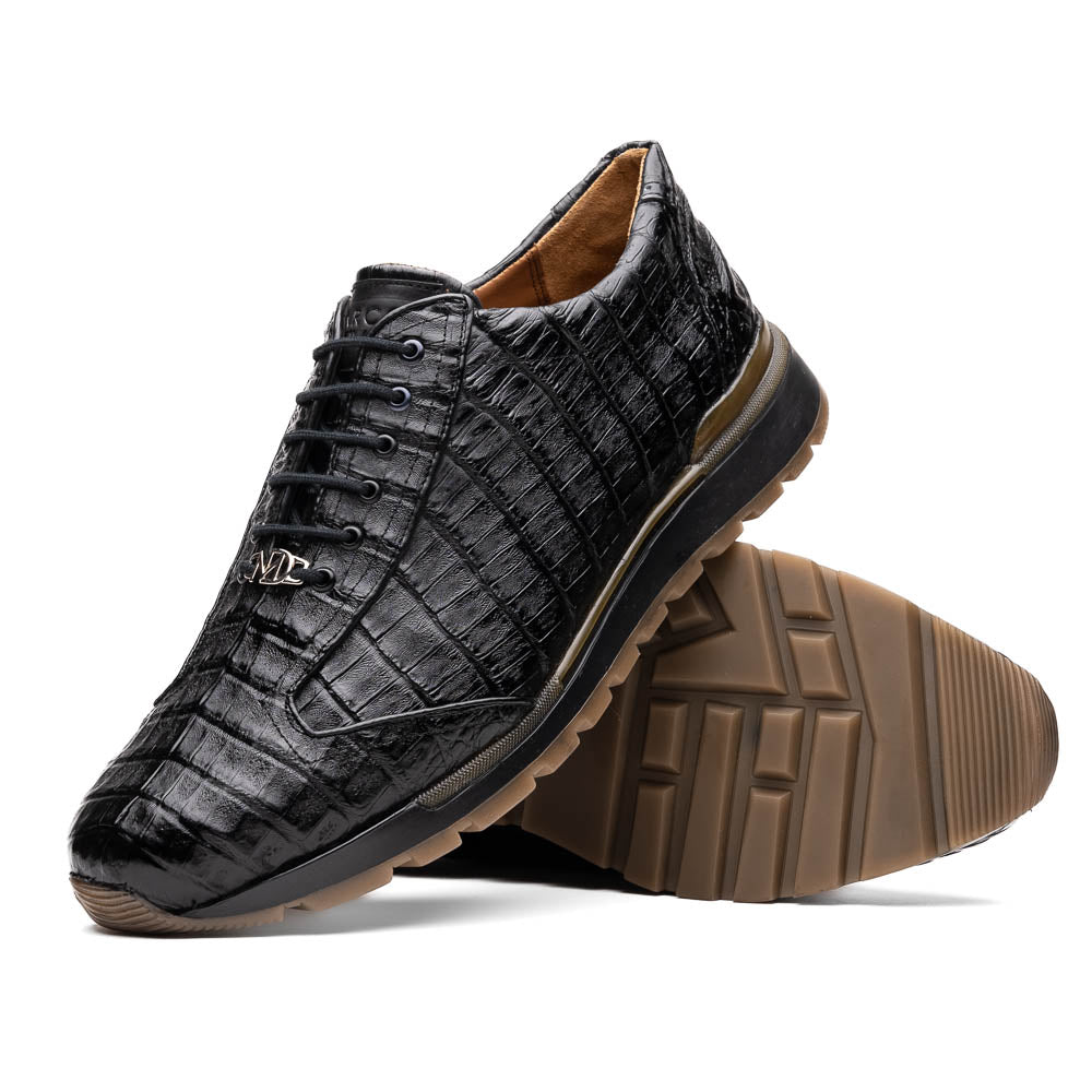 The Alonzo Black by Marco Di Milano: luxury men's sneakers crafted from black genuine caiman crocodile leather with a hand-painted finish and brown rubber soles—one shoe upright, the other leaning against it.