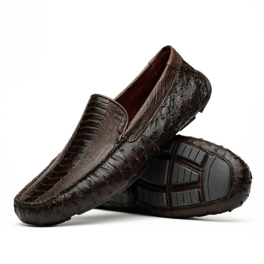 The Alba Kango Tabac by Marco Di Milano: brown textured leather loafers with visible stitching, one flat and one side-propped to reveal the sole—luxury footwear with artisanal hand-painted finishes.