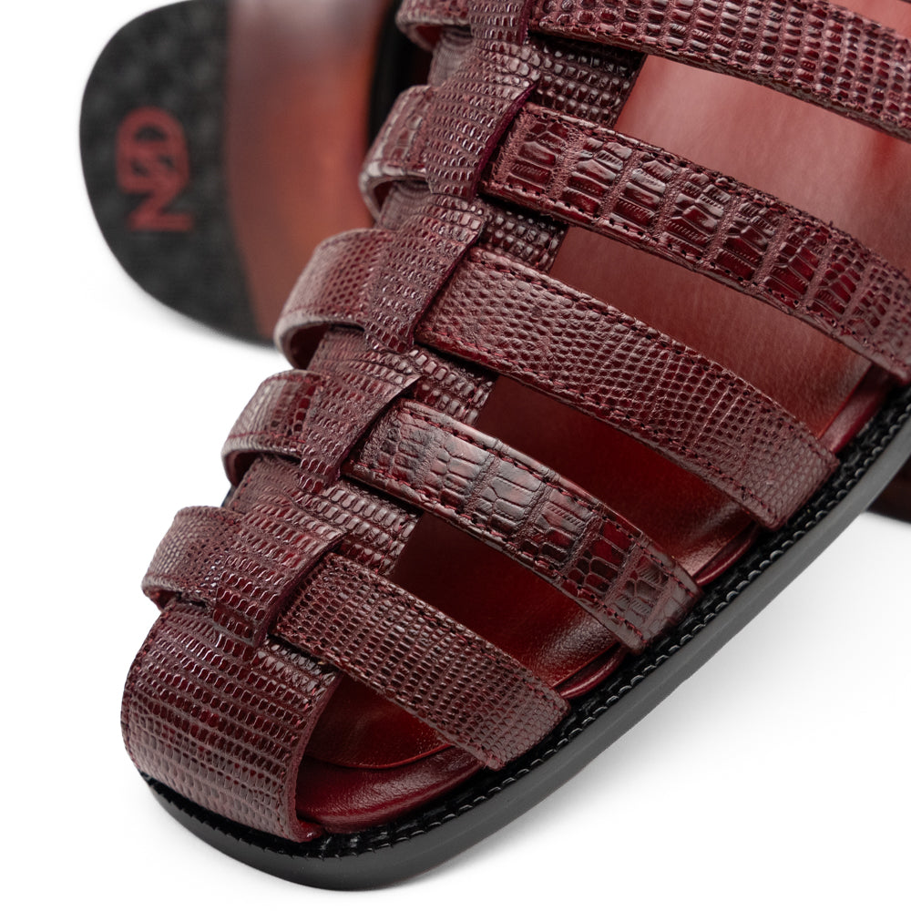 Albero Wine handcrafted dark red goat leather gladiator-style sandal by Marco Di Milano featuring a buckled ankle strap and a flat sole.