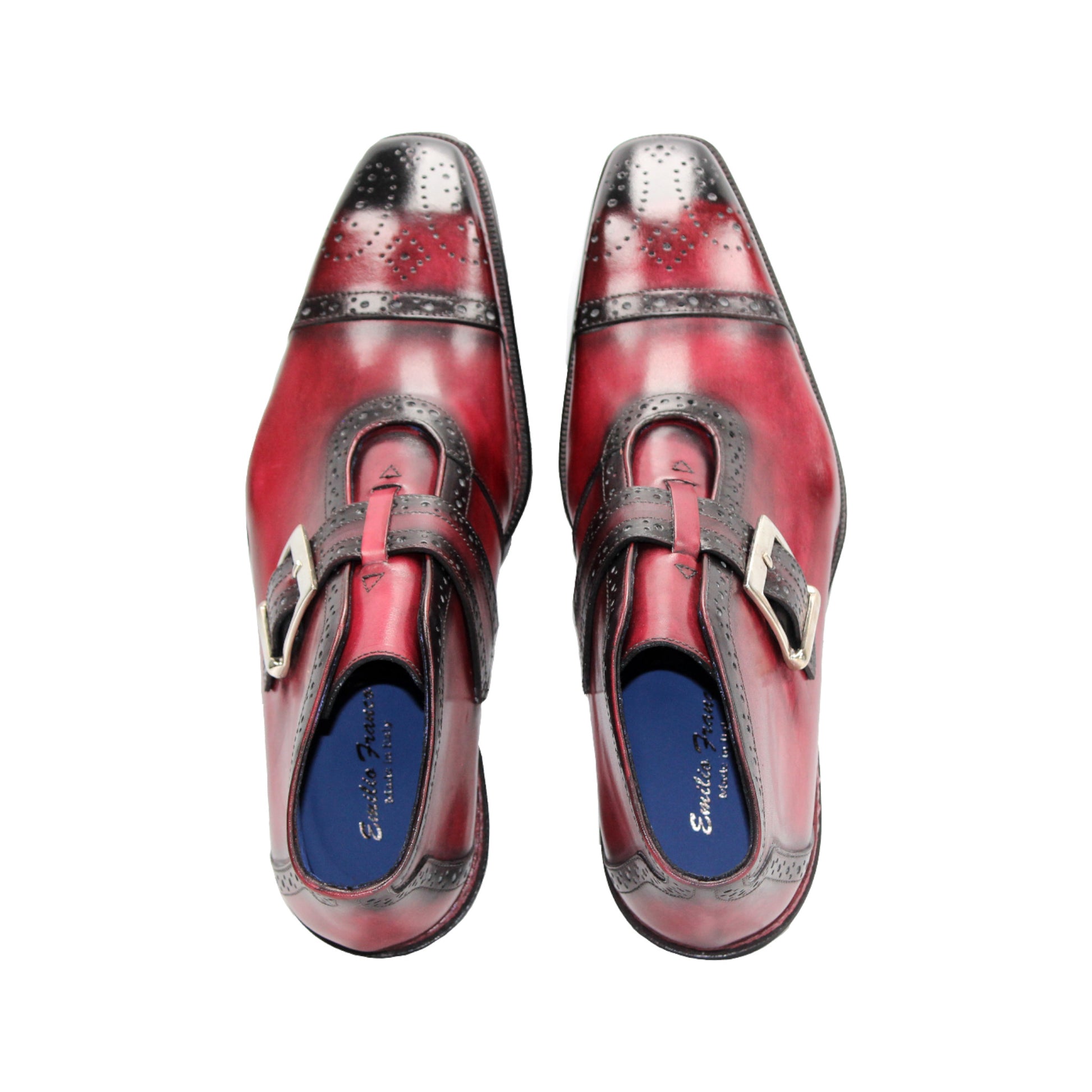 The Emilio Franco Aldo Antique Red is a genuine leather dress shoe with a black cap toe, decorative perforations, side buckle, and black heel—ideal for anyone seeking the elegance of Italian footwear.