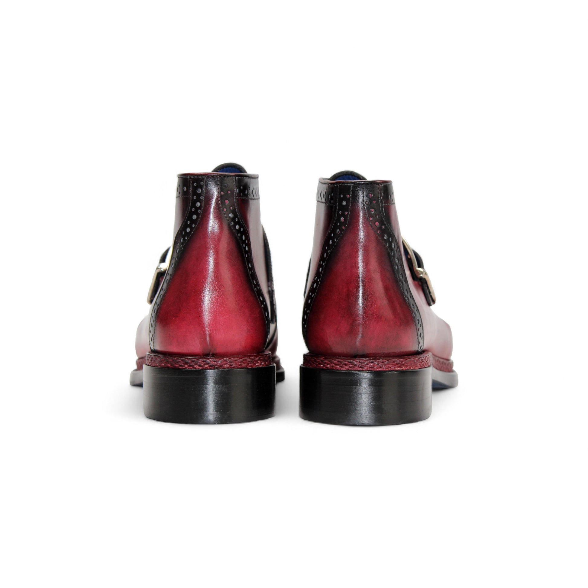 The Emilio Franco Aldo Antique Red is a genuine leather dress shoe with a black cap toe, decorative perforations, side buckle, and black heel—ideal for anyone seeking the elegance of Italian footwear.