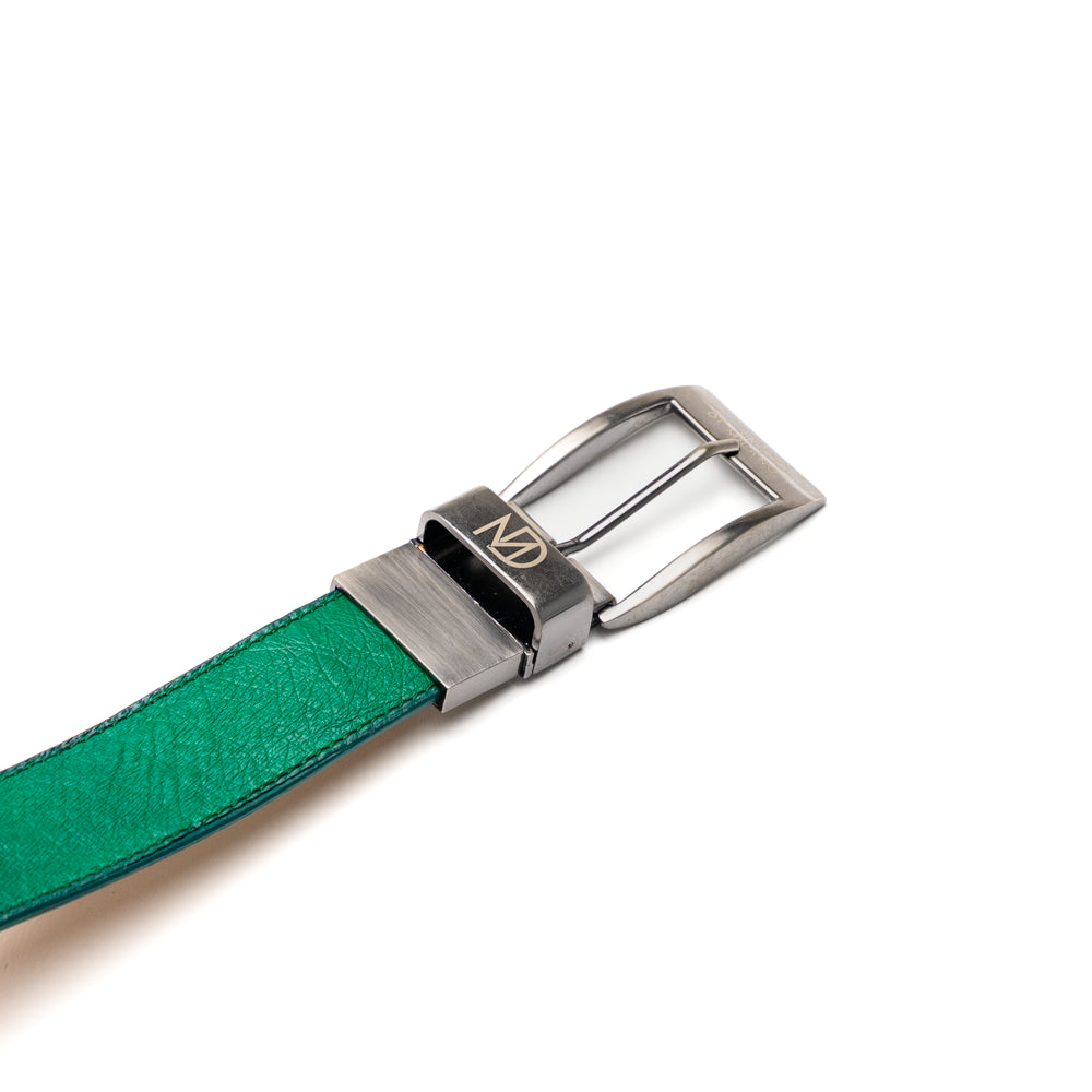 Introducing the Alessio Belt Lemon Green by Marco Di Milano—a coiled green leather belt with a silver buckle, featuring an embossed texture and the brand name “Marco Di Milano” engraved on the buckle. This handcrafted luxury accessory is designed to elevate any wardrobe with its refined elegance.