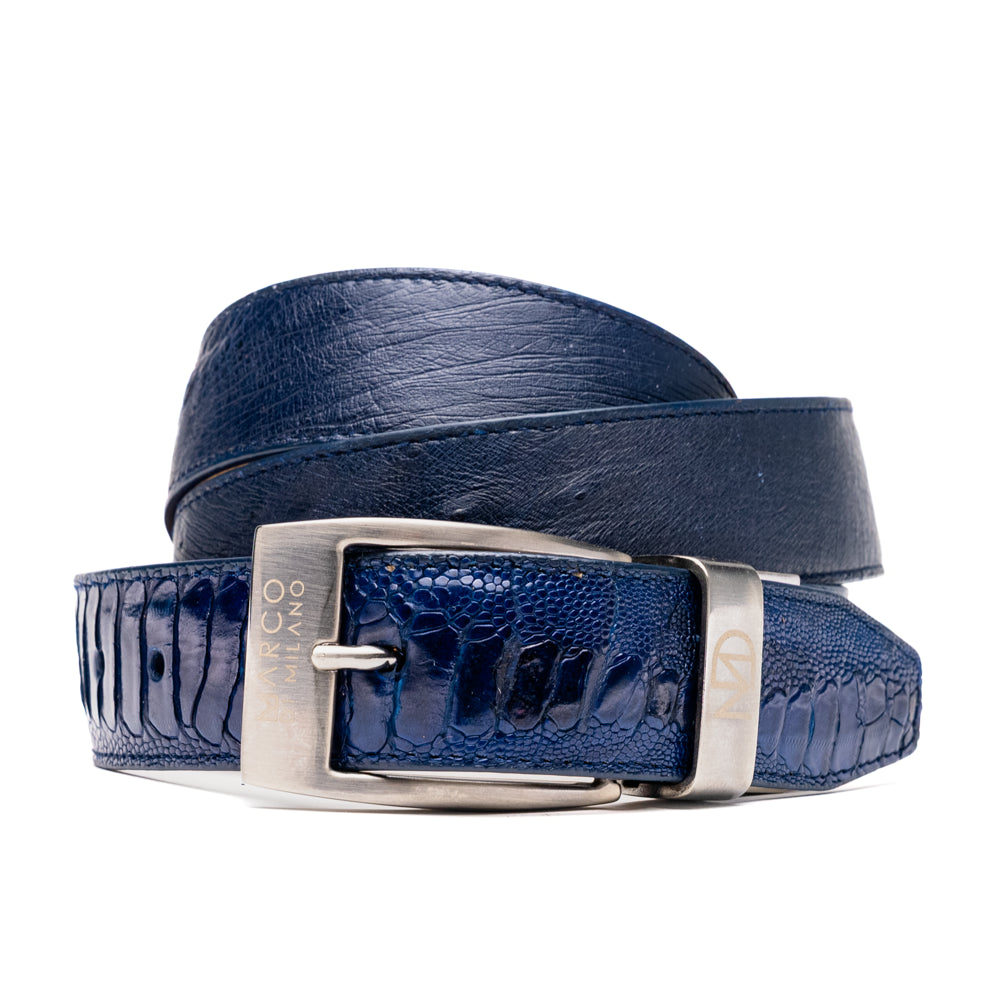 The Alessio Belt Navy by Marco Di Milano is a coiled blue handcrafted luxury belt with a silver buckle, featuring both smooth and textured crocodile-patterned sections.
